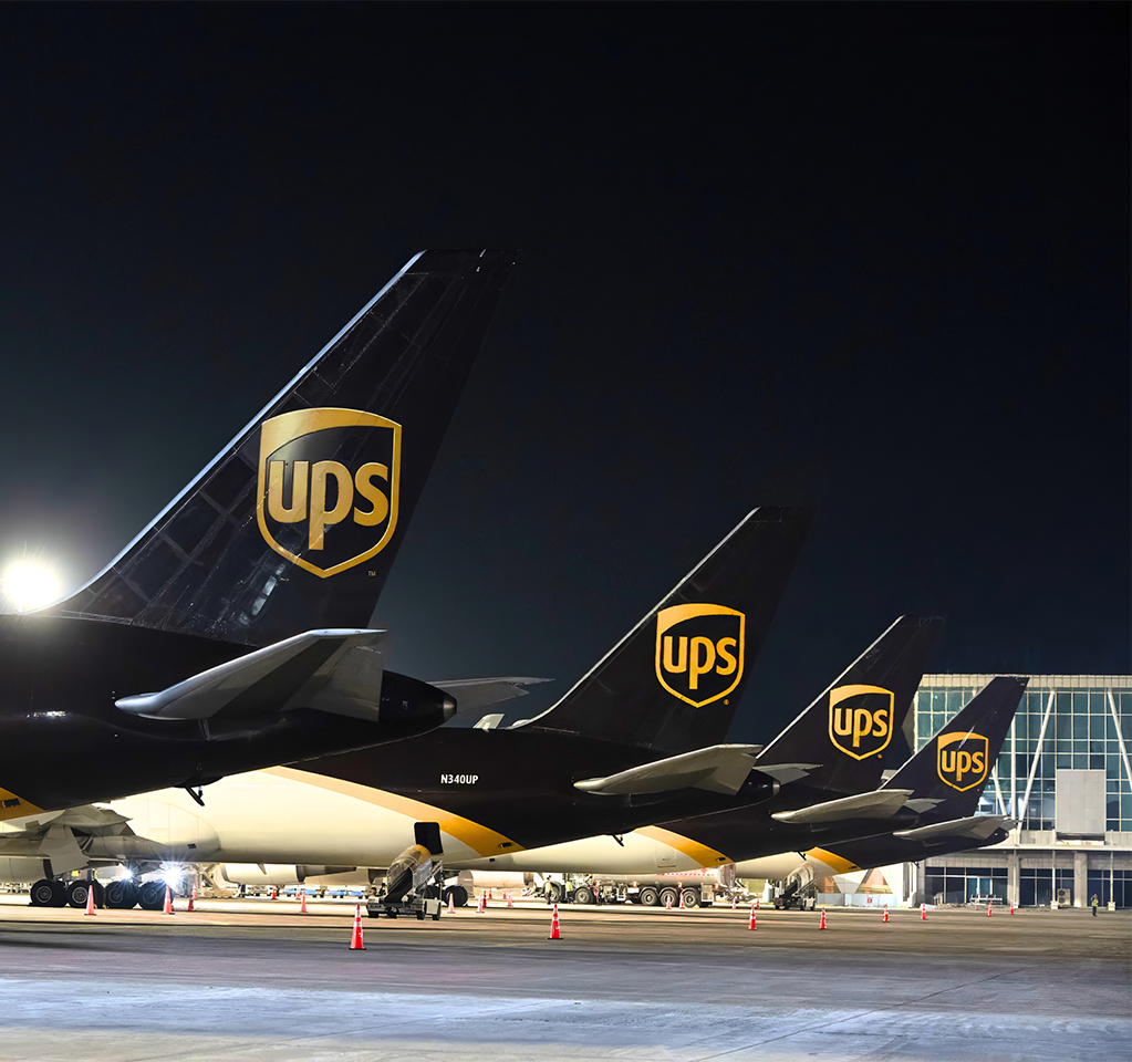 UPS cargo airplanes lined up at night