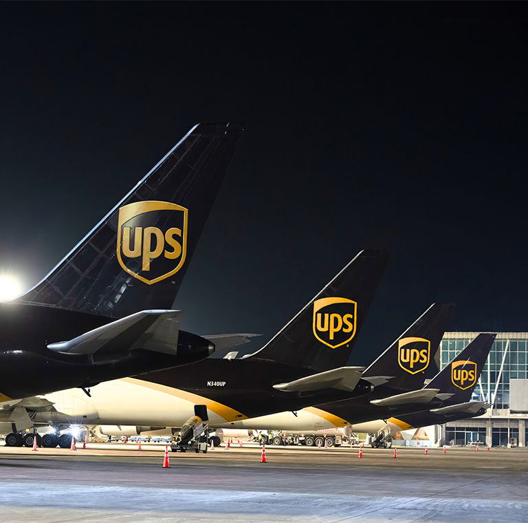 UPS cargo airplanes lined up at night