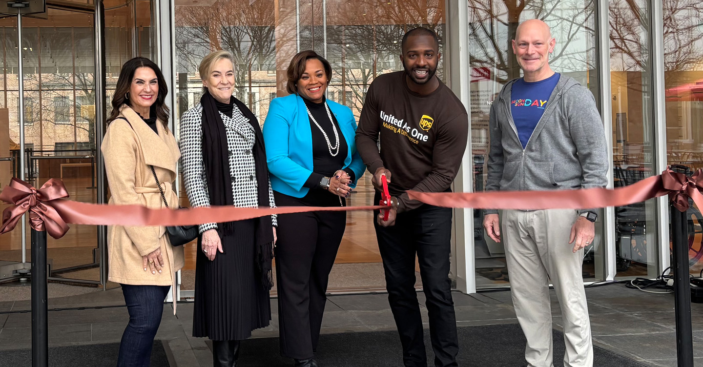 Photo of UPS employees and partners smiling at The High Museum