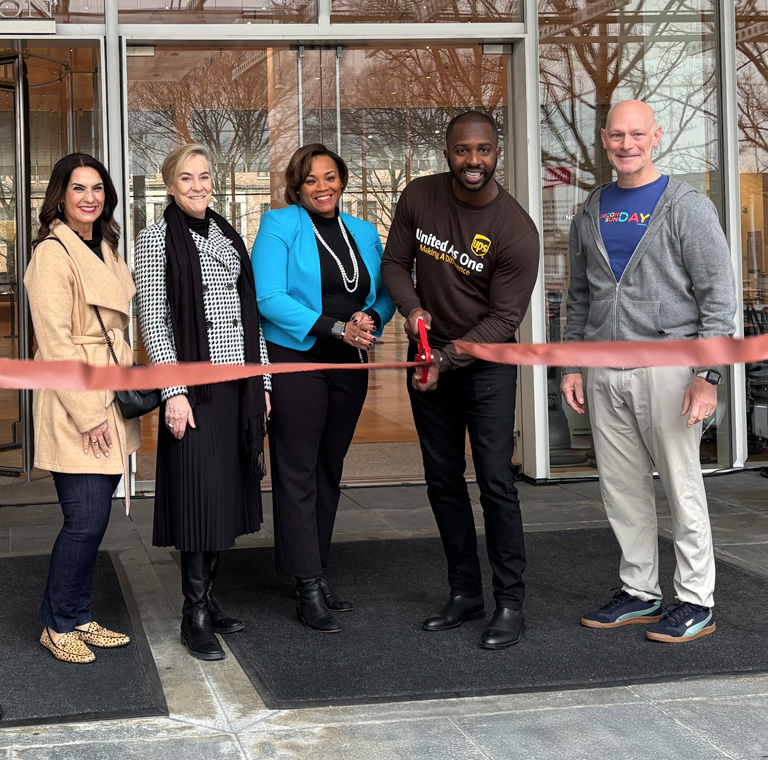 Photo of UPS employees and partners smiling at The High Museum