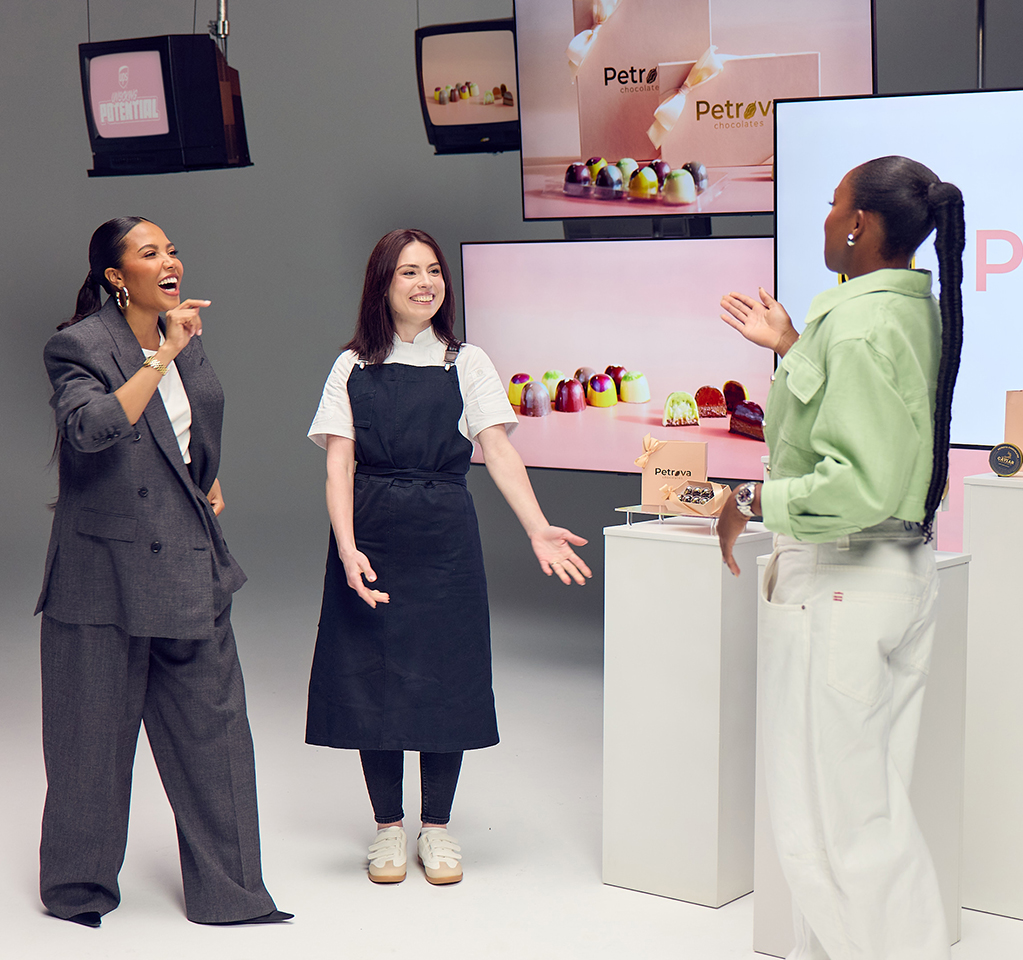 Group discussing colorful chocolate display
