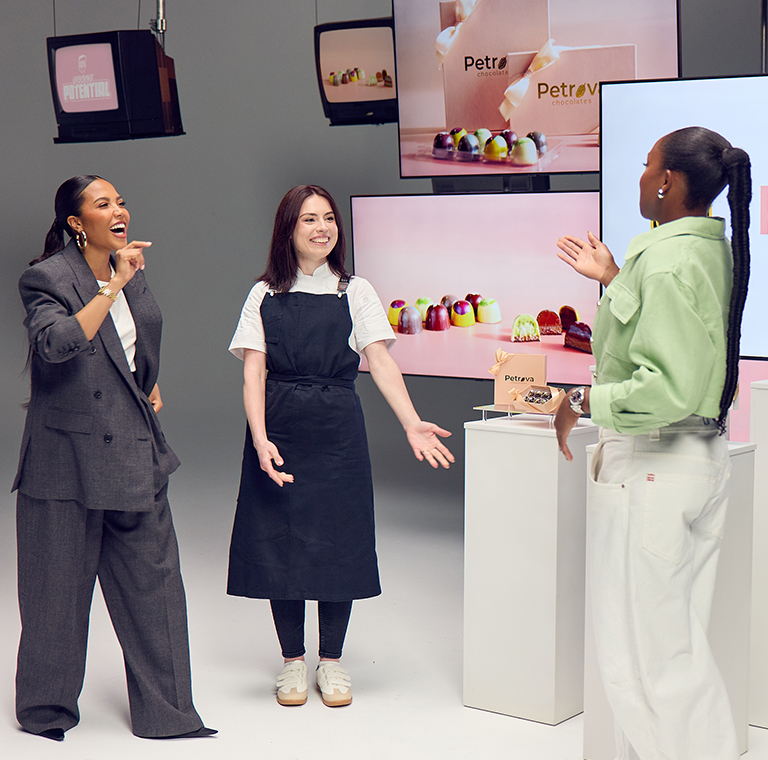 Group discussing colorful chocolate display