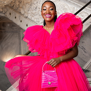 Woman in dramatic hot pink ruffled gown