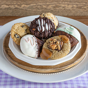 Assorted gourmet cookies on layered plates