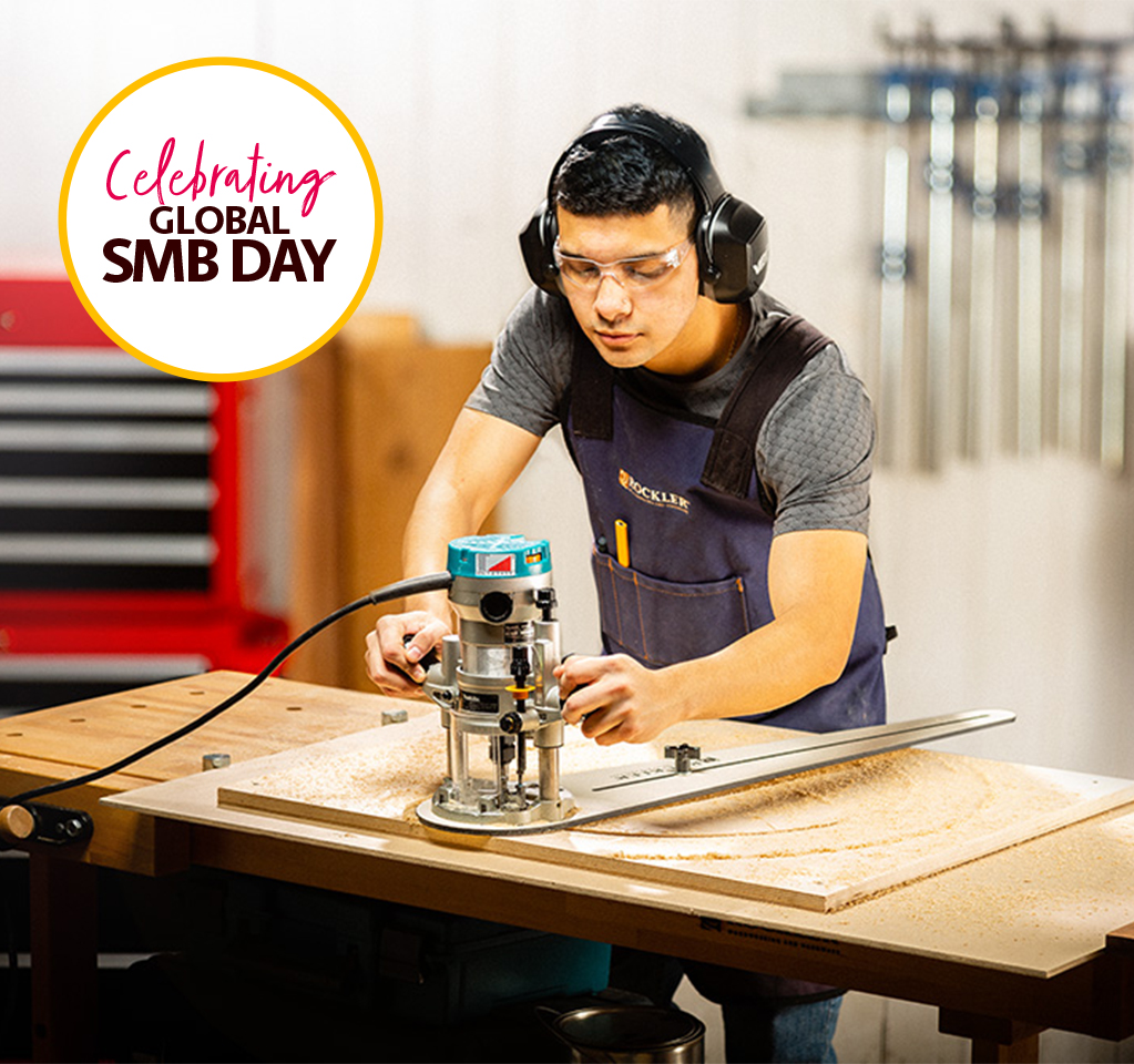 Woodworker Using Router in Workshop Setting