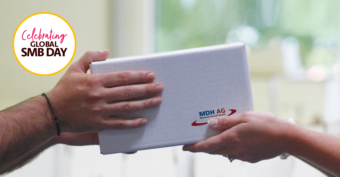 Hands Exchanging Gift Box on SMB Day