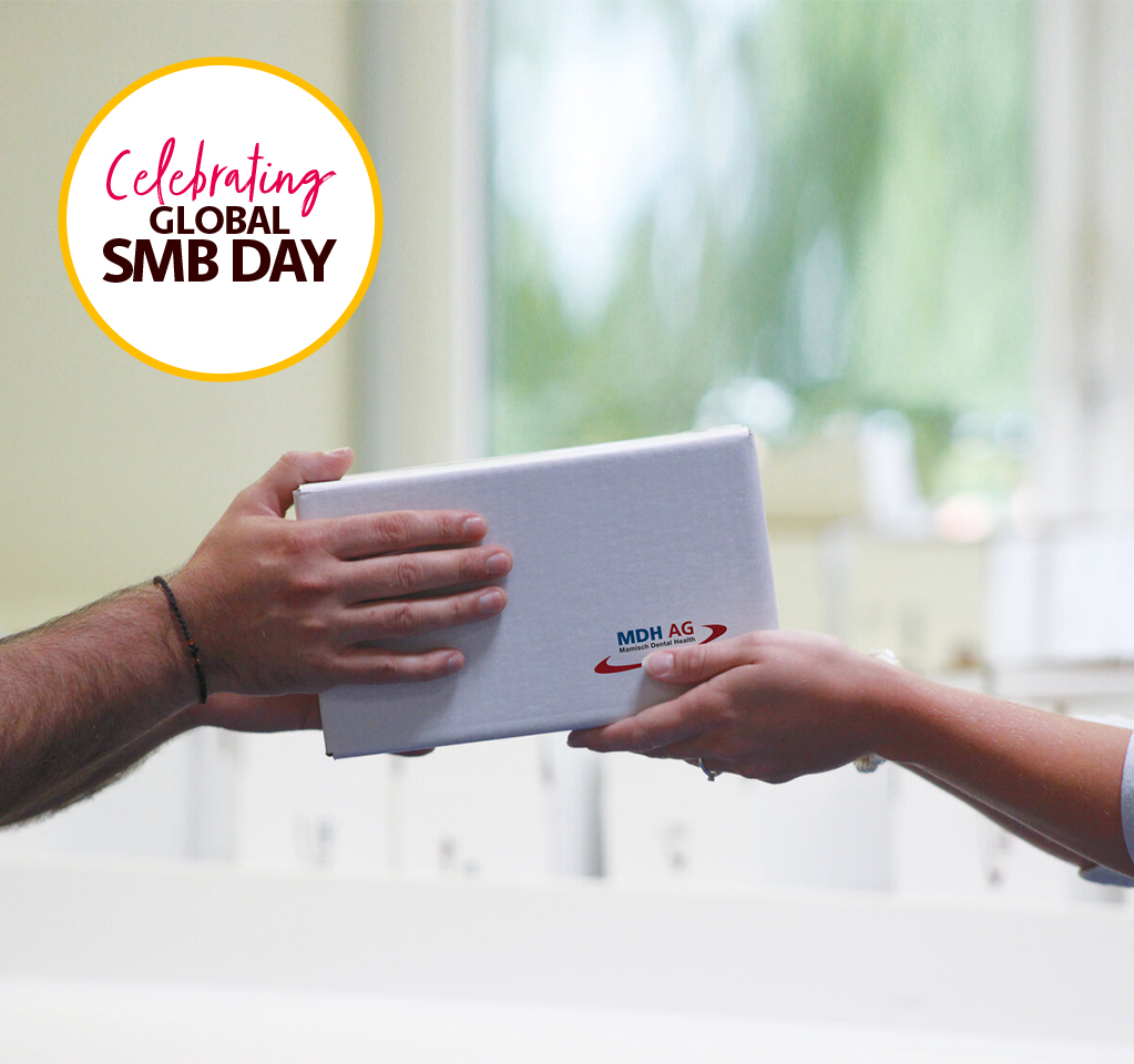 Hands Exchanging Gift Box on SMB Day