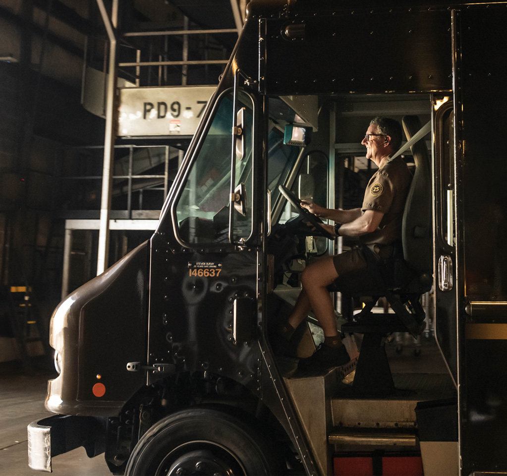 UPS delivery driver in package car