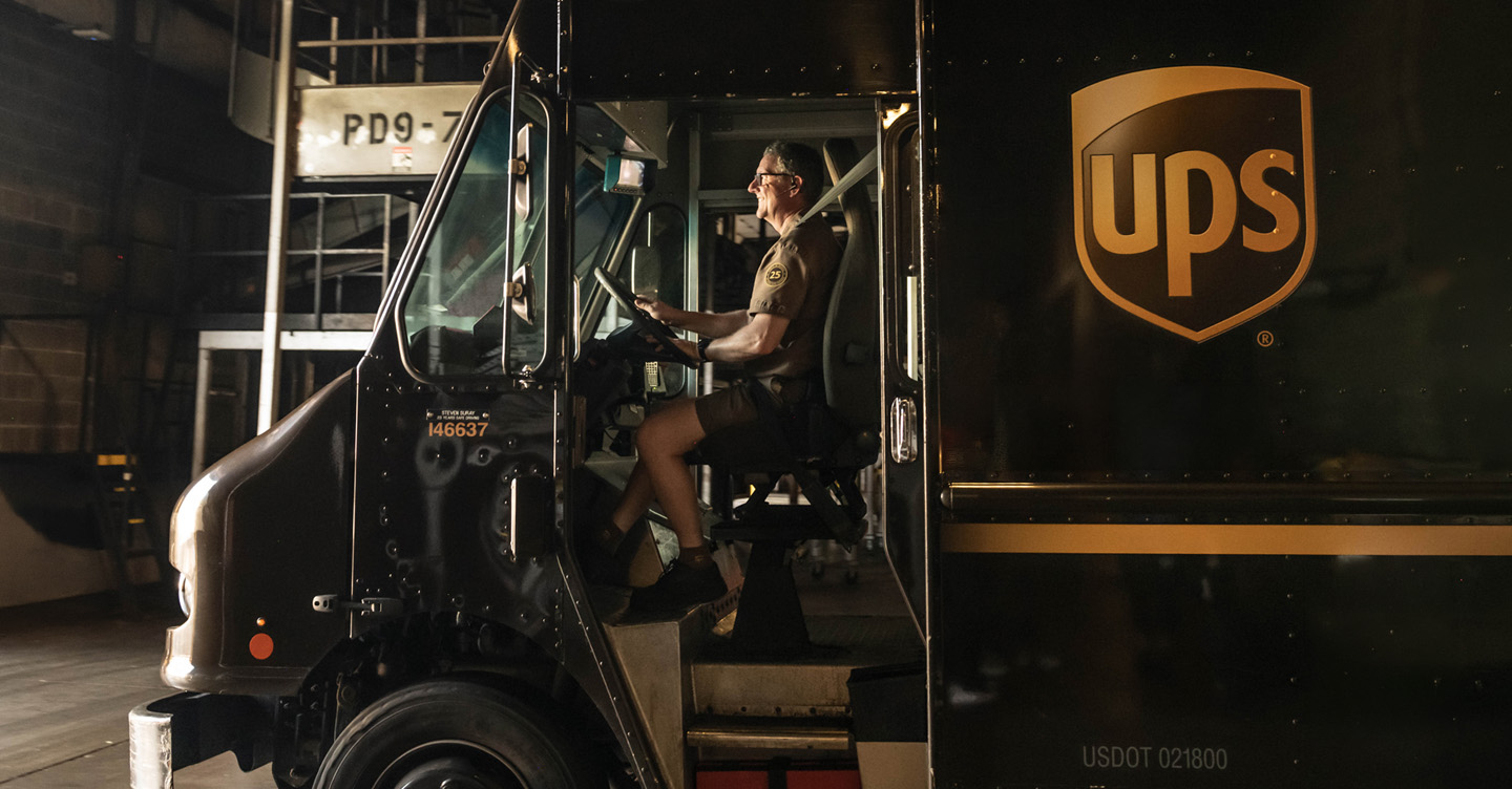 UPS delivery driver in package car
