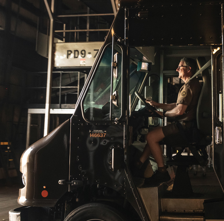 UPS delivery driver in package car